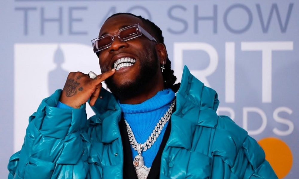 brit awards 2020 burna boy takes winter to the red carpet in blue 1200x800